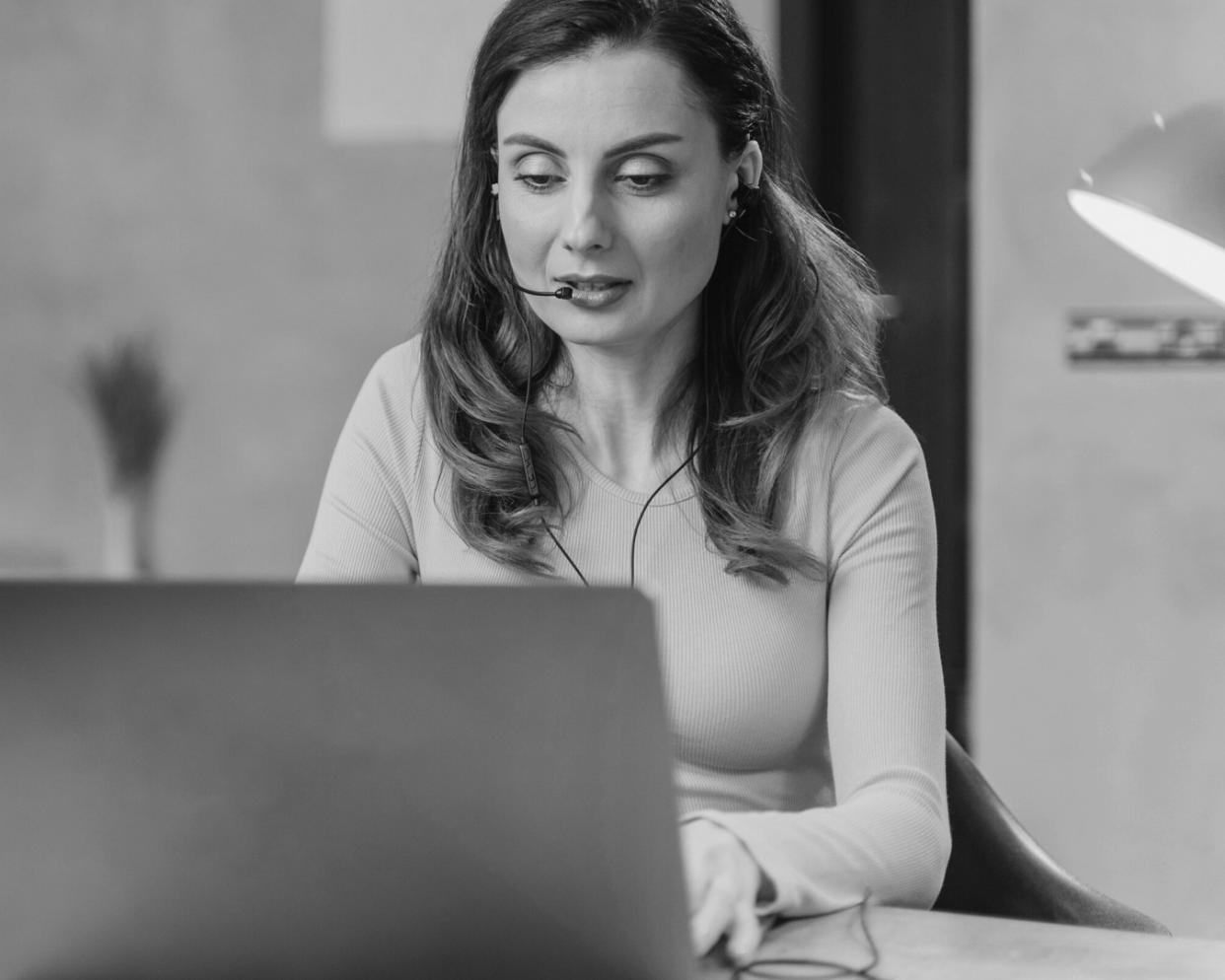 Finance professional analyzing budget compliance reports